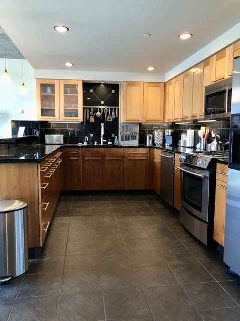 Spacious Chef’s Kitchen with JennAir appliances and full amenities