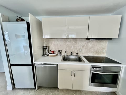 Complete kitchen with Miele Dishwasher & Stove, Samsung Fridge and all utensils