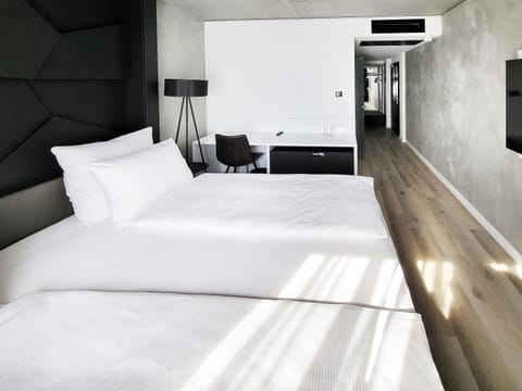 Hypo-allergenic bedding, free minibar, in-room safe, desk