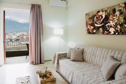 City Apartment, 1 Queen Bed with Sofa bed, Balcony, City View | Living area | 55-inch LED TV with premium channels, TV