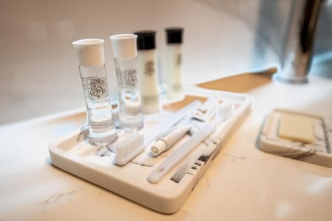 Shower, rainfall showerhead, hair dryer, towels