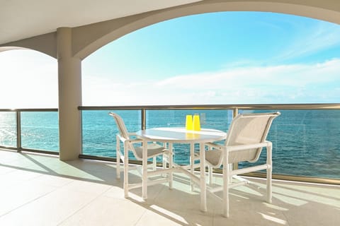Your private oceanfront balcony offers breathtaking sea views where you can sip morning coffee or evening cocktails while listening to gentle waves.