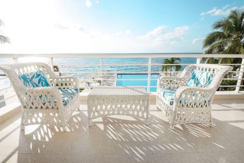 Admire the gorgeous coastal view from the classy furniture on the terrace!