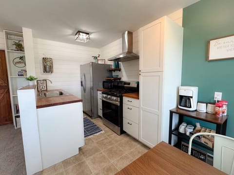 Remodeled kitchen with new appliances and stocked fully for you to cook meals
