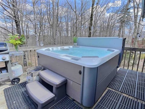 Soak in the hot tub with mountain views.