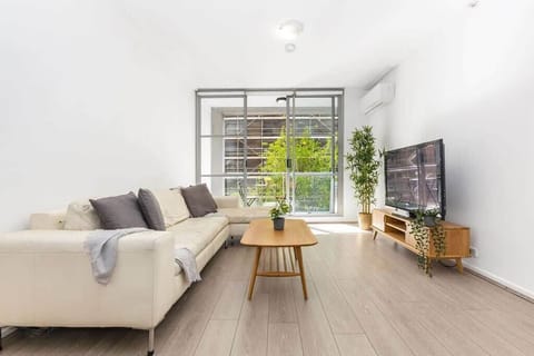 A spacious living area with a 3-seater couch.