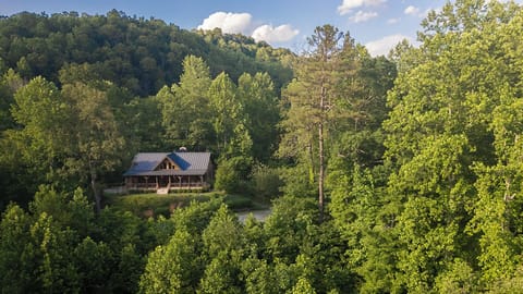 The cabin sits high atop a ridge surrounded by lush forest - complete privacy!