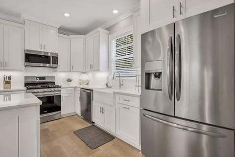 Kitchen with a gas range and stainless steel appliances