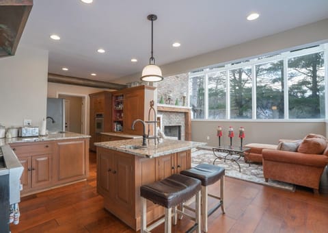 Open layout kitchen with sun room
