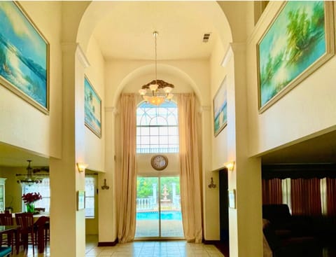 Hall way with vew to patio and pool.