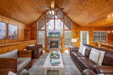 Living area with leather sofa, loveseat and 2 chairs