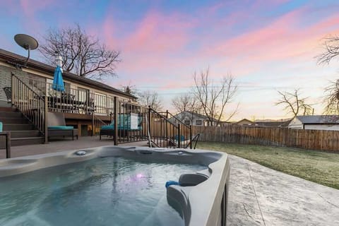 The hot tub is large enough for 4 people and has jets and lights.