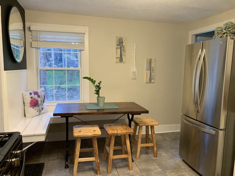 Our cozy kitchen table with custom made benches from a local woodworker.