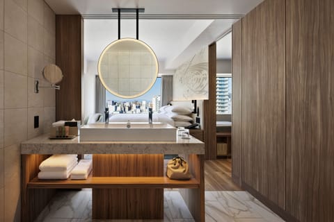 Suite, 1 King Bed, Corner | Bathroom | Free toiletries, hair dryer, slippers, electronic bidet