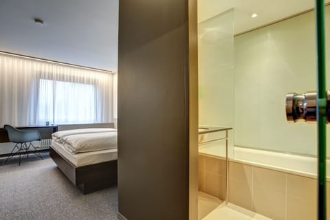 Standard Double Room | Living area | 49-inch flat-screen TV with satellite channels, TV