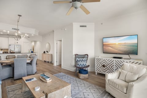 All New floring throughout - Living area with large Smart TV, cable provided to connect devices.