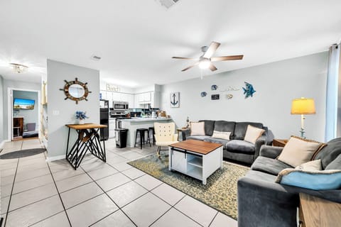 Large living space, kitchen, bunkbeds in hallway, king bed