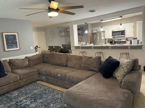 [Duplex Side A] [Living Area] The entire family can sit and relax in front of the fireplace and tv on the large sectional and enjoy a great movie!