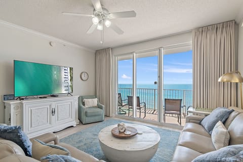 This 3BR/3 BA updated condo features a bright and open living and dining space with tall ceiling, Gulf views, and plenty of seating around a large Smart TV for all your streaming needs.