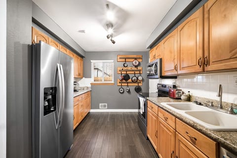 Kitchen is set up and full of cooking utensils and new appliances