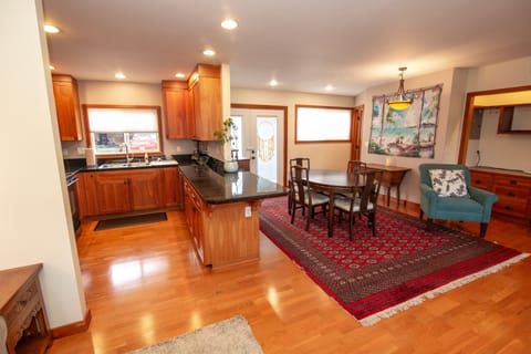 View from couch, looking at Dining Room & kitchen