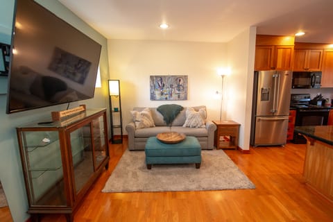 Sitting area & 72" TV. Queen Sofa Sleeper.