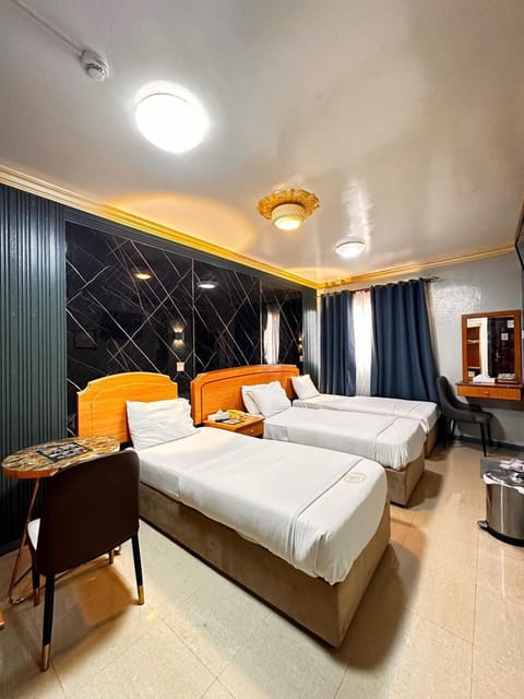 Triple Room | Minibar, iron/ironing board, free WiFi, bed sheets