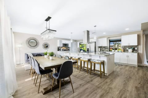 Welcome to Gulf Coast Cabana—a bright, open kitchen and dining area with a fully stocked setup and cozy coffee bar, perfect for meals, conversation, and relaxed mornings together.