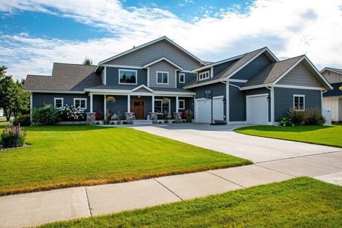 Exterior shot of home and beautifully manicured lawn