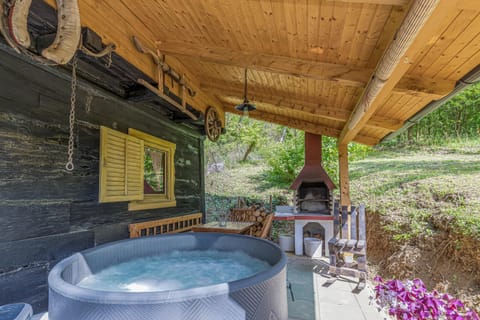 Terrace with hot tub and brick grill