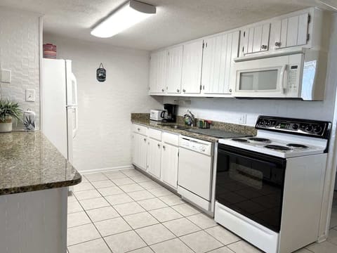 Fully stocked kitchen with everything you need for home-cooked meals by the beach.

