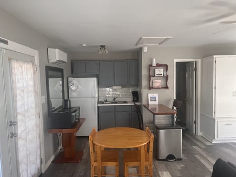 Kitchen has Microwave, Toaster, Oven, Two Hot Plates, Pans, Pots & Utensils