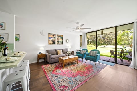 Main living area with queen sleeper sofa looking to the lanai.