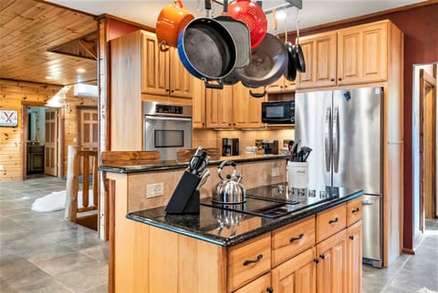 Pots/pans in a huge open concept kitchen that has room for everyone during meals