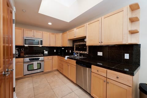 Kitchen fully stocked with cookware and bakeware.