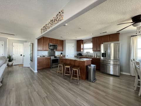 Open concept living/kitchen/dining makes family gatherings spacious and comfy.