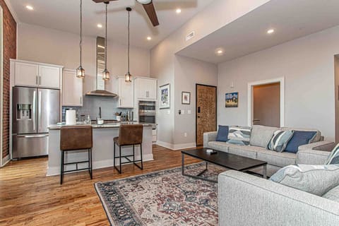 Living Space: Modern elegance with open layout, stainless steel appliances, and inviting decor.