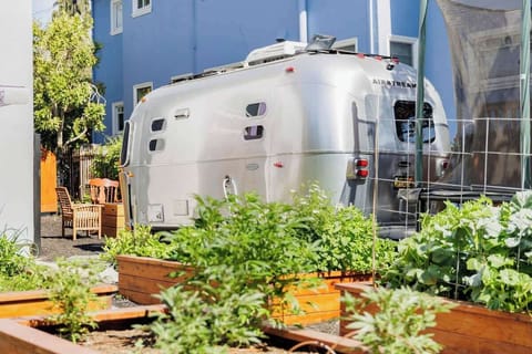 The Airstream on the side of the house.