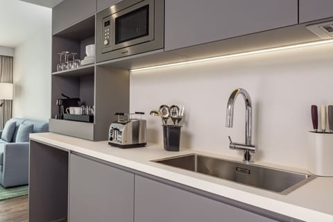 Suite, 1 Bedroom | Private kitchen | Mini-fridge, microwave, stovetop, dishwasher