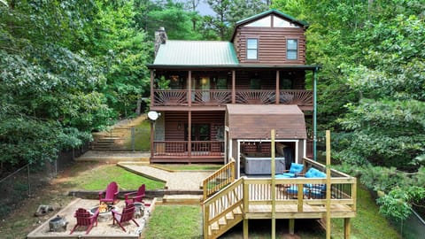 [BACKYARD] - Your backyard oasis awaits: open fire pit, covered hot tub and amazing outdoor decks to relax on. Embrace mountain cabin living
