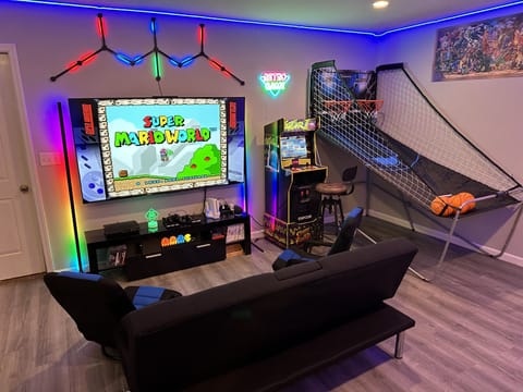 New game room with 1000s of games: Shuffle board, arcade, basketball, pinball.
