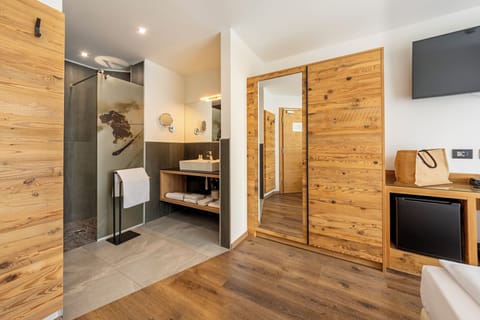 Shower, rainfall showerhead, slippers, towels