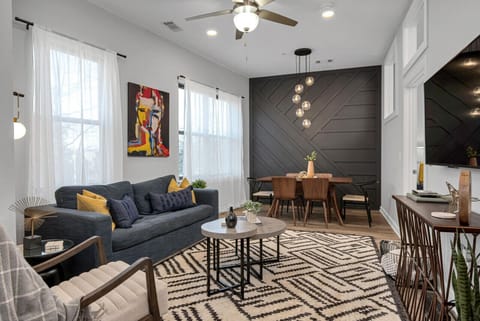 Spacious living room with Queen pullout couch, dining table with seating for 6, HD TV with YouTube TV for cable and all the apps you could want plus a walkout private patio with seating for 2.