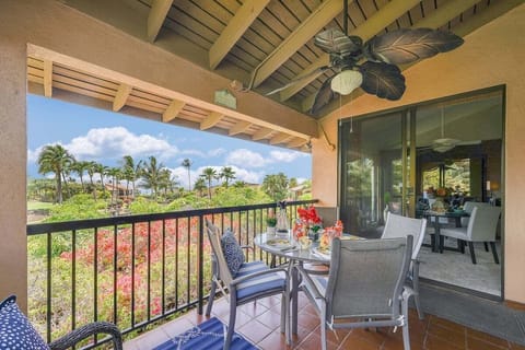 Patios open to palms and sky, tables set beneath fans shaped like leaves.