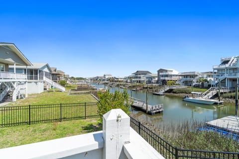 fenced yard on canal with private gazebo