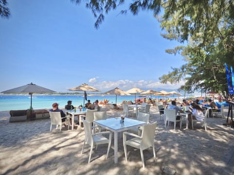 On the beach, sun loungers, beach umbrellas, scuba diving
