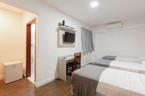 Triple Room | Minibar, desk, blackout drapes, free WiFi