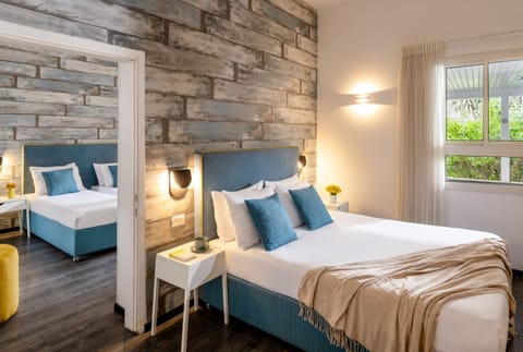 Family Room, 2 Bedrooms | Minibar, desk, soundproofing, iron/ironing board
