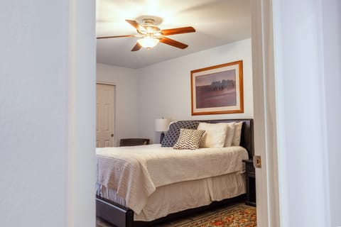 Entry to bedroom suite. Queen bed with pillowtop mattress and extra pillows.