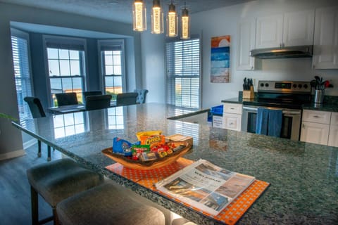 Large fully stocked kitchen with snacks, coffee, large island and beach views